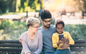 happy-young-mixed-race-couple-spending-time-with-their-child