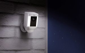 ring spotlight camera on outdoor wall