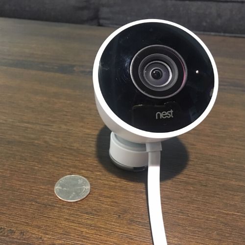 Nest Outdoor camera with quarter for scale
