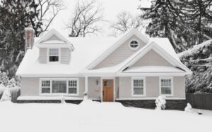 Suburban home covered in snow