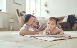Smiling Father with Infant Daughter