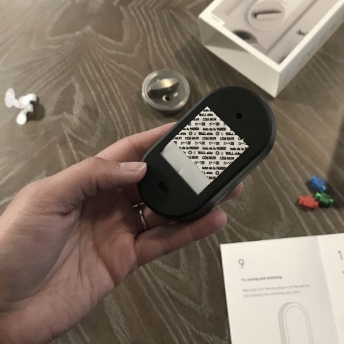 back of simplisafe lock keypad with adhesive mount attached