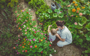 mother and son planting flowers