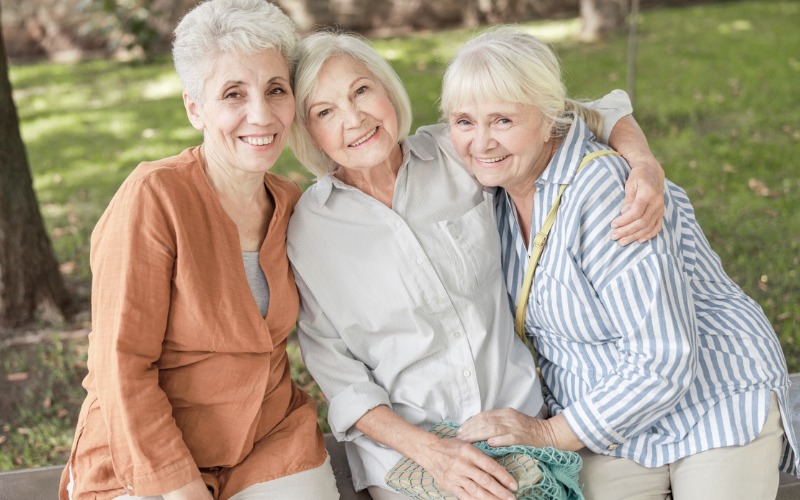 happy older women sitting together