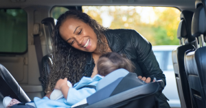 baby in car seat with mom