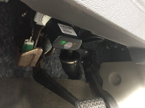 The Bouncie GPS vehicle tracker installed in safety expert Kasey Tross's car.