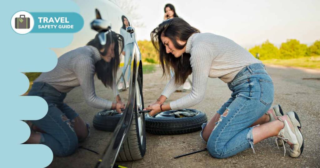woman changing tire on car