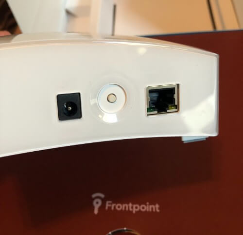The Frontpoint hub has an ethernet port, a power port, and a reset button.