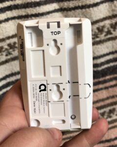 The back of Frontpoint's motion sensor includes a sticker that tells you which side is the top so you can mount it correctly.
