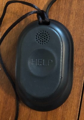 The Bay Alarm Medical Mobile GPS Help Button sitting on its charging cradle at our tester's home.