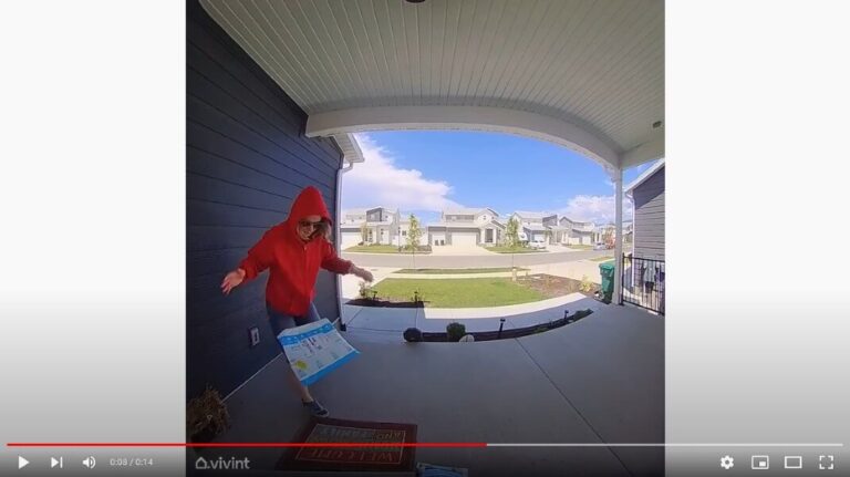 A screenshot of our Vivint Doorbell's Smart Deter feature in action: the test-thief drops the package.