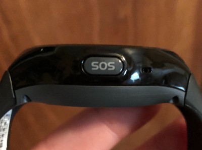 A close-up of the Bay Alarm Medical SOS smartwatch SOS button.