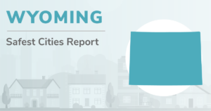 Outline of Wyoming with the heading "Wyoming Safest Cities Report"