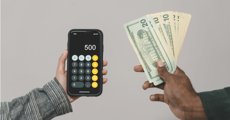 Person holding calculator that says 500 and another person holding money
