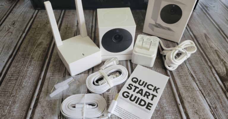 Wyze Cam Outdoor v2, quick start guide, base station, and cords