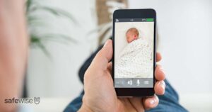 person-looking-at-baby-monitor-feed-on-phone