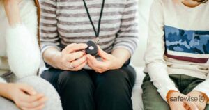 woman-holding-medical-alert-necklace