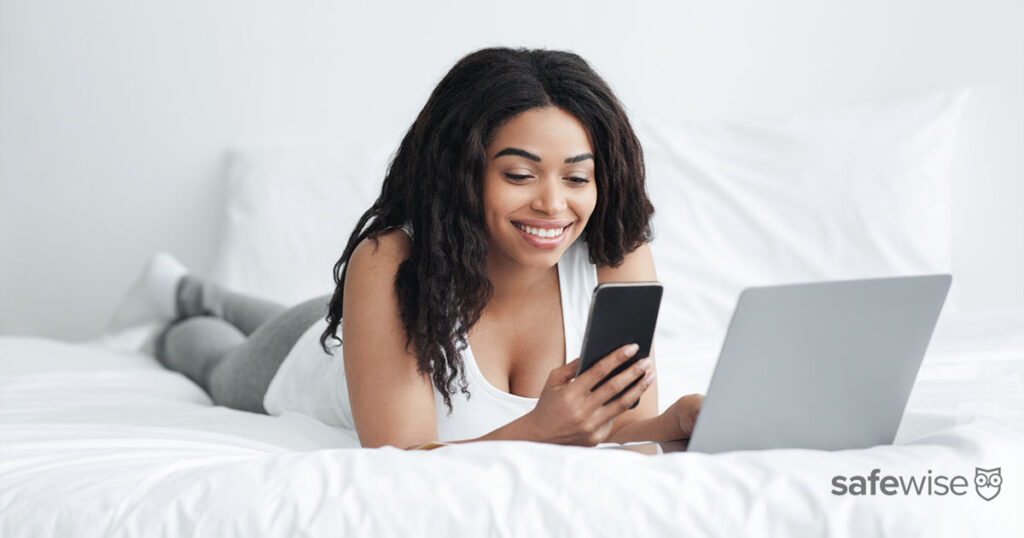 woman-using-phone-and-laptop-together
