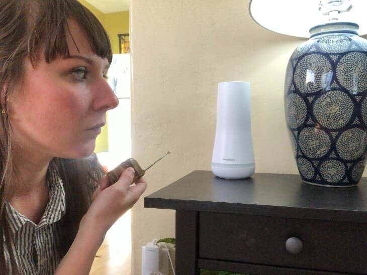 Person next to simplisafe equipment