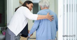 dementia patient getting help from a nurse