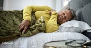 elderly woman laying in bed