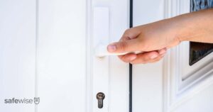 person-using-front-door-handle