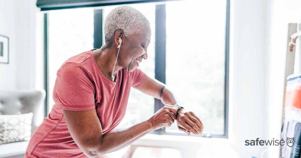 senior woman using tracking wristband