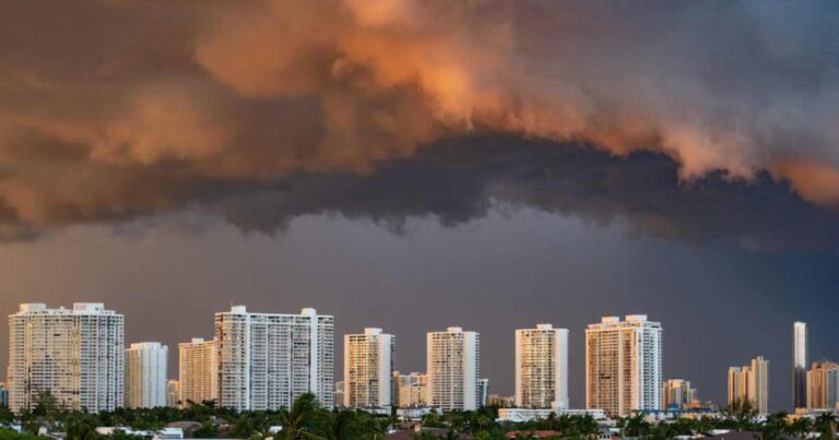 residential high rise apartment buildings with dark tropical storm clouds in Aventura, Florida at the beginning of hurricane season 2020