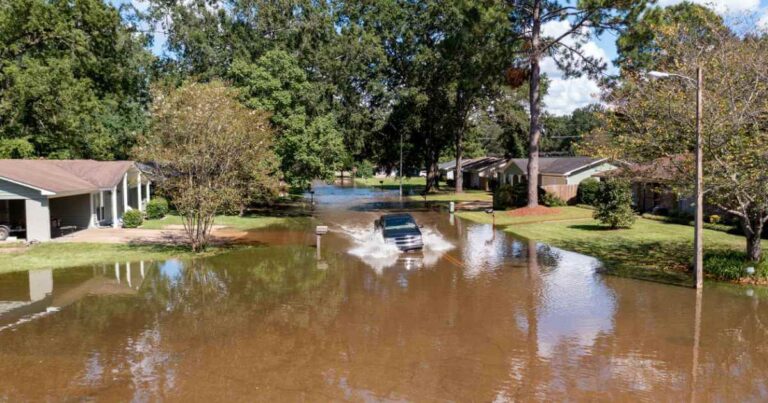 Pearl River flood water rising in a neighborhood in Jackson MS August 2022