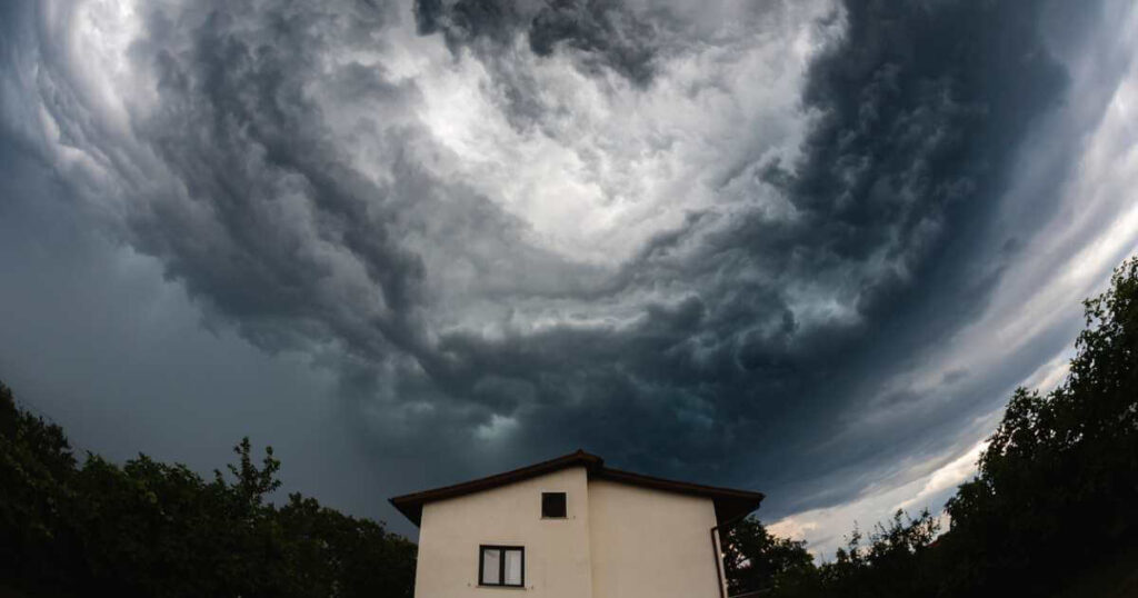 House With Storm Clouds Above