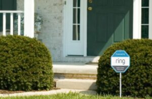 ring security yard sign in grass in front of house
