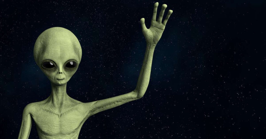 Friendly Alien greeting and waving hand stock photo