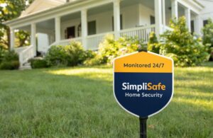 simplisafe security yard sign in grass in front of house