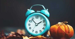 Teal Alarm Clock with Fall Decorations for Daylight Savings Time