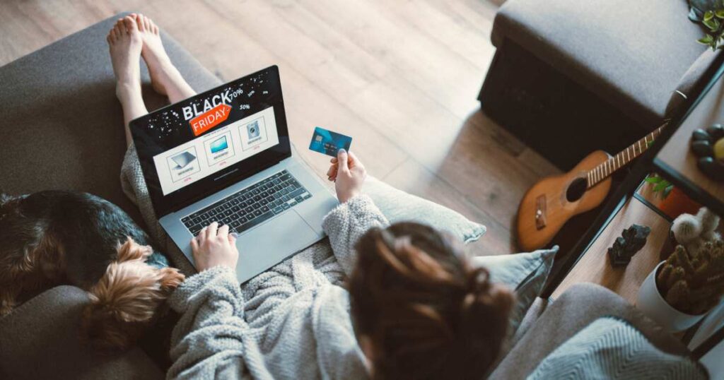 Woman shopping electronic online at Black Friday discount. stock photo