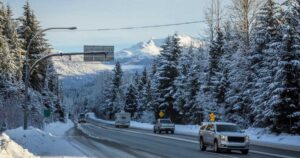 Cars driving on highway in winter. Whistler, Canada. stock photo