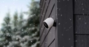 SimpliSafe Outdoor Cam on side of house while it's snowing.