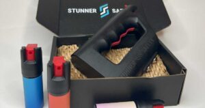 The Stunner in its box with pepper spray canisters