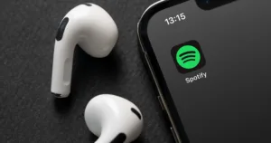 iPhone smartphone screen showing Spotify Music App logo