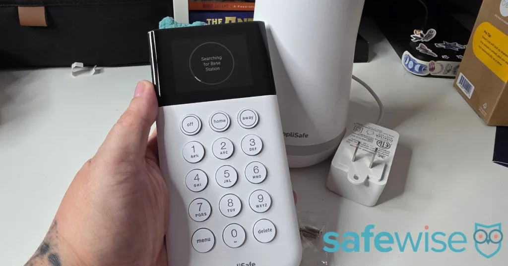 Alina installing the SimpliSafe base.