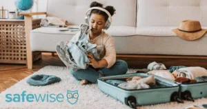 Little girl packing her suitcase.
