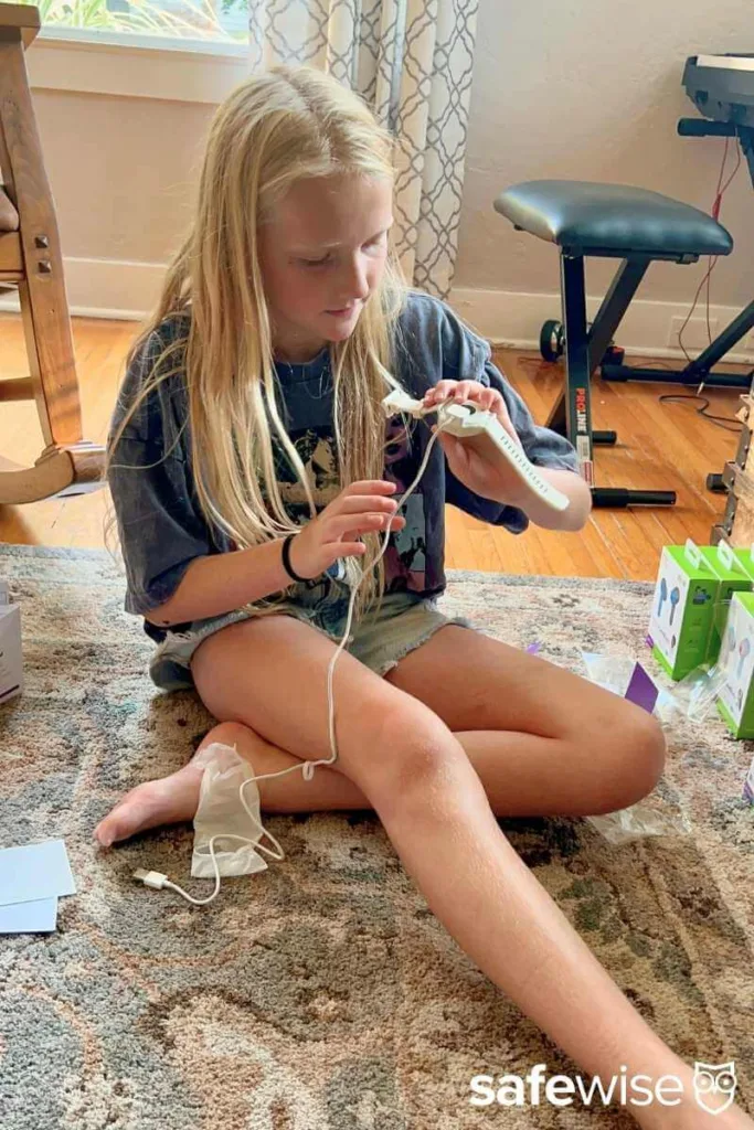 Our kid tester figuring out how to charge the myFirst Fone R2.