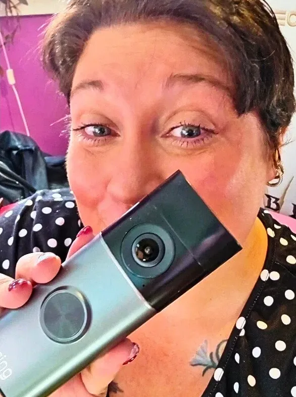 Alina Bradford holding the Ring Battery Doorbell Pro.