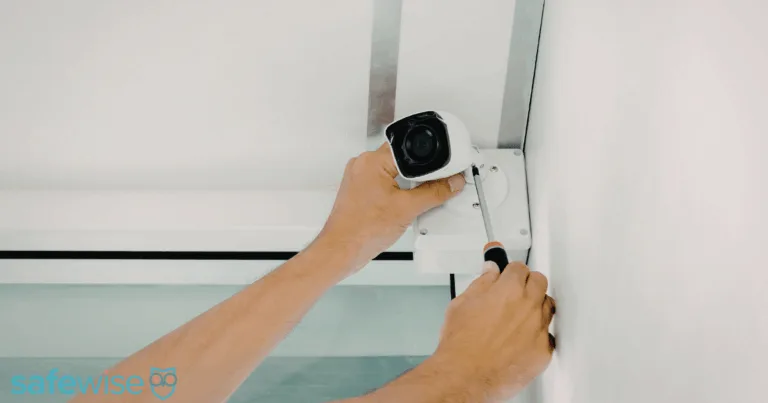 Home owner installing a security camera