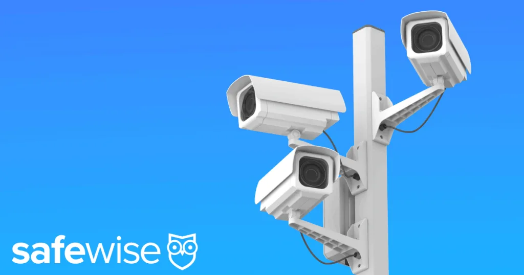 Network of neighborhood cameras against a blue sky