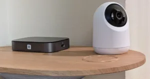 SwitchBot Pan/Tilt Cam Plus 3K and AI Hub on table