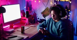 Relaxed teenager surfing the net at home at night