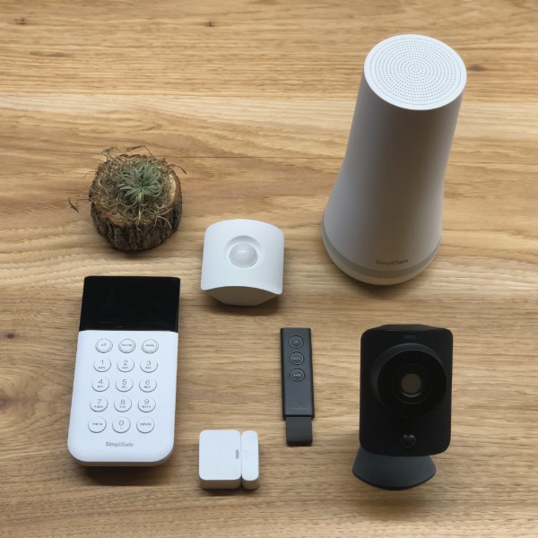 photo of simplisafe system on a wooden table