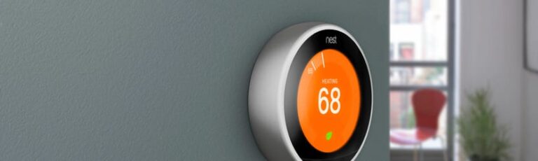 Nest smart thermostat on the wall