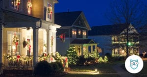 Row of houses decorated with lights for Christmas